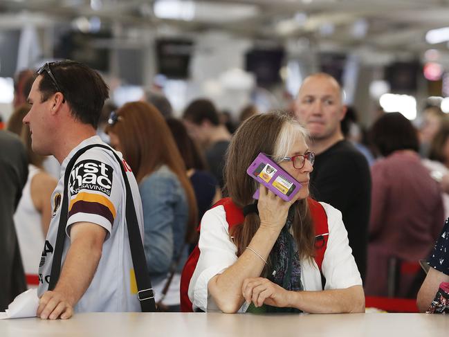 An airline passenger is seen at Sydney Domestic Airport in Sydney during a technical delay, Monday, September 25, 2017. Virgin Australia, Qantas and Jetstar have confirmed the problem is affecting flights. Hundreds of passengers have been affected after the "technical issue" occurred about 5am on Monday. (AAP Image/Daniel Munoz) NO ARCHIVING