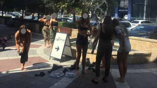 The girls shocked onlookers after dancing semi-naked in the fountain at Erina.