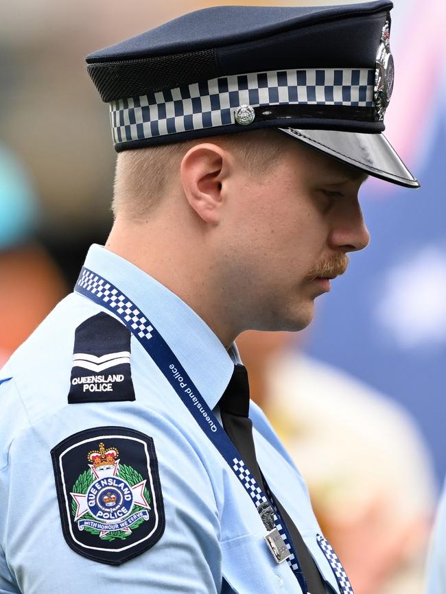 A young constable during the minute’s silence. Picture: Bradley Kanaris/Getty