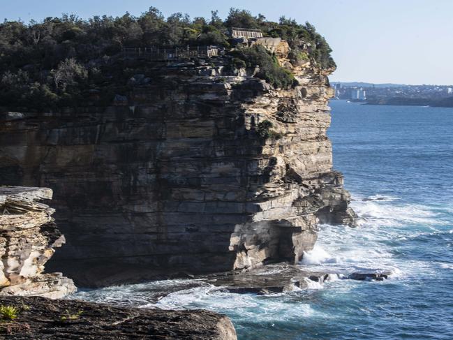 Police are scaling back their search of Sydney’s coast around South Head, which has been carried out in rough conditions. Picture: Monique Harmer