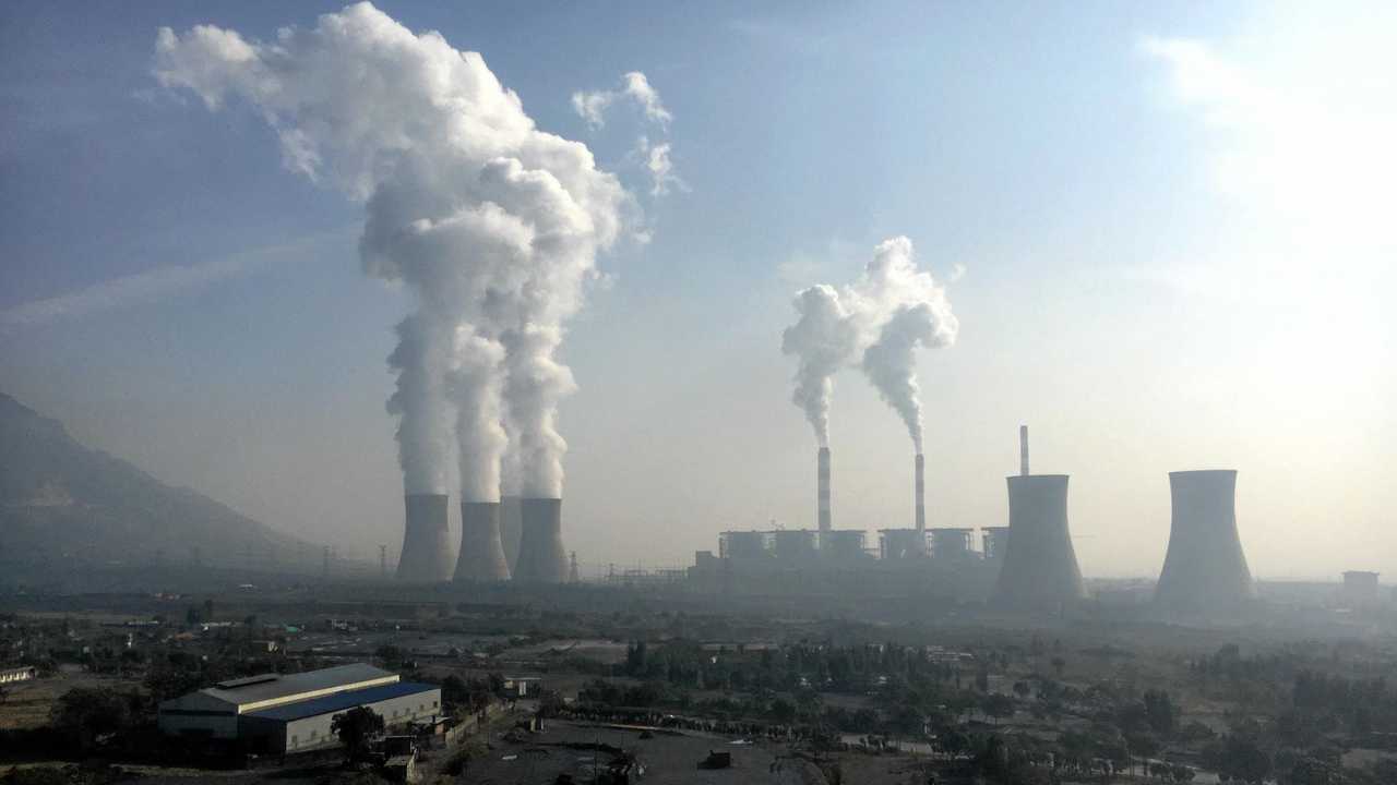 Smoke and steam are discharged from chimneys and cooling towers at a coal-fired power plant in Jiyuan city, central China's Henan province, 30 October 2016. Picture: Wen Jie