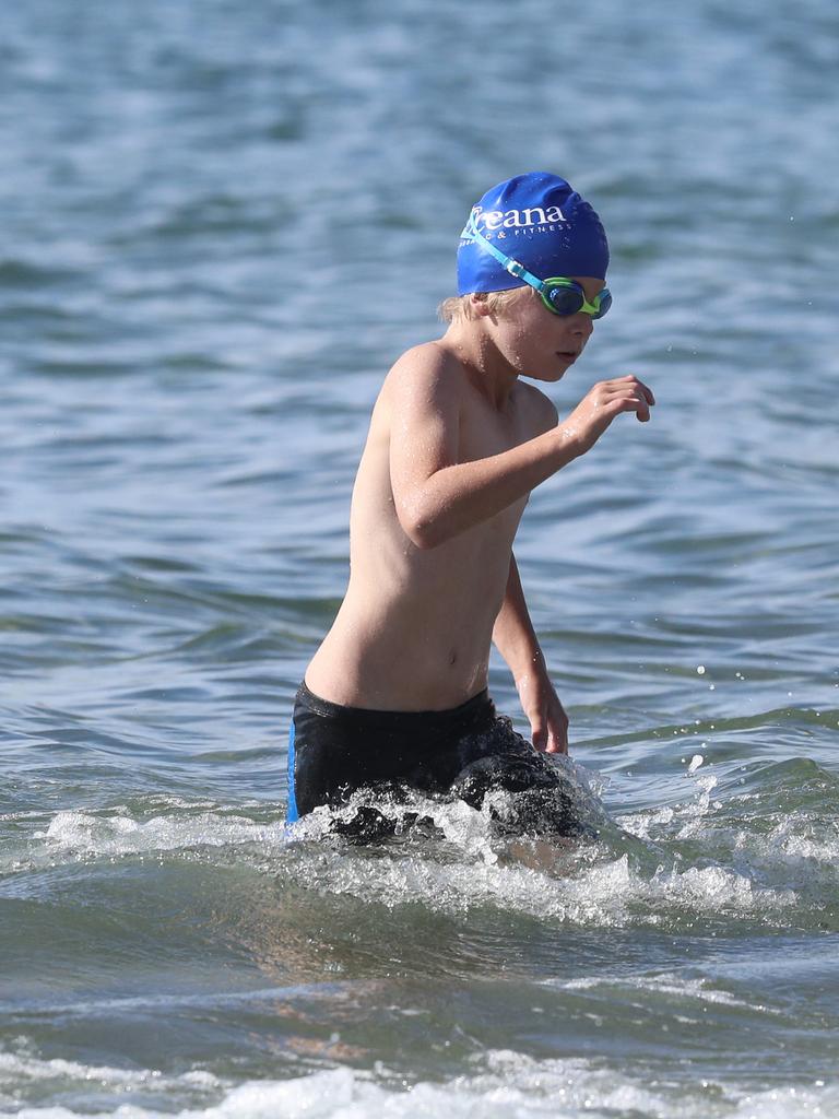 Participants competing in the Bupa KidFit Series triathlon at Blackmans Bay Beach. Picture: LUKE BOWDEN