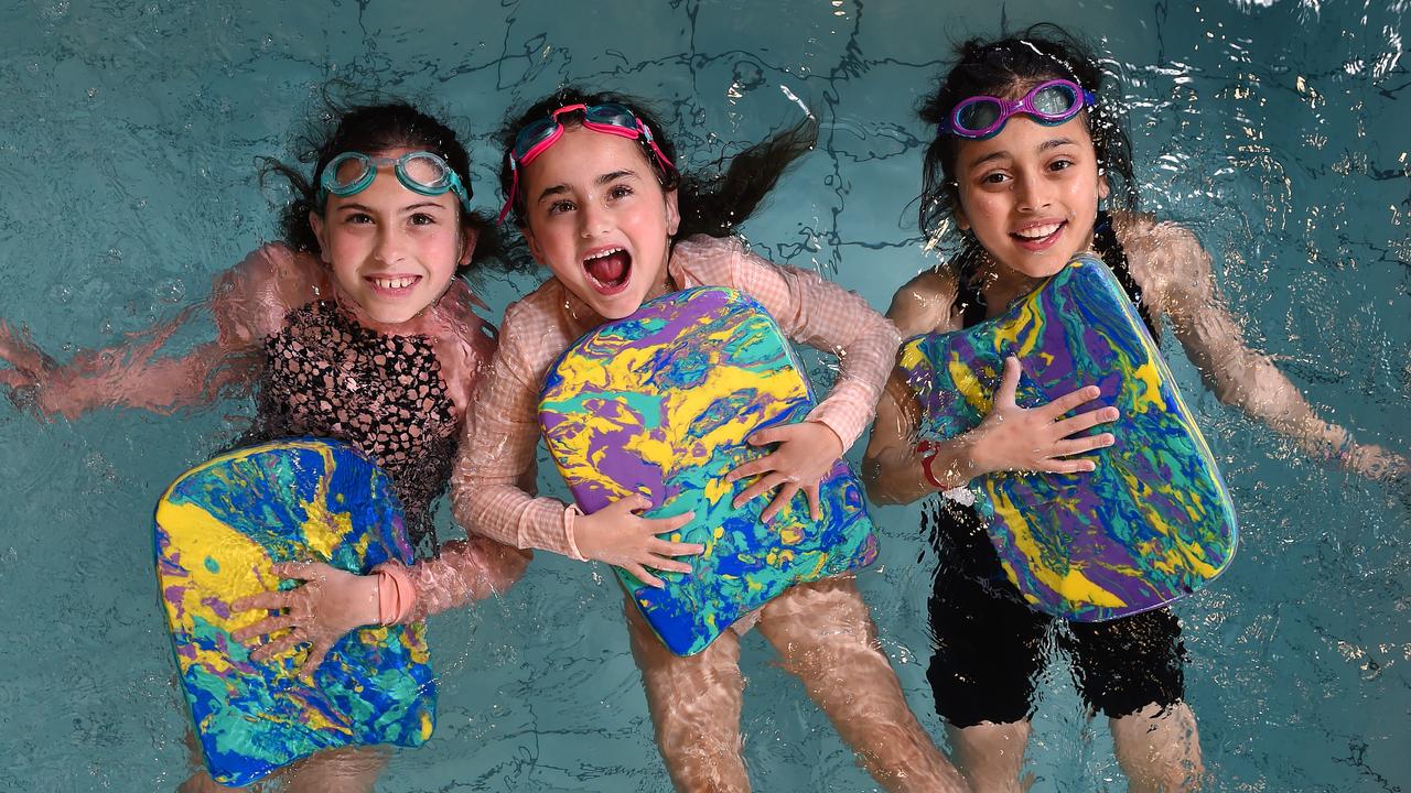 Siena Blythe, 8, Aria Blythe, 6, and Leen Alzawati, 9, learning to swim. Picture: Josie Hayden