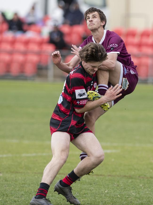 Charlie Cooper (right) boots the ball for Dalby against Valleys. Picture: Kevin Farmer.