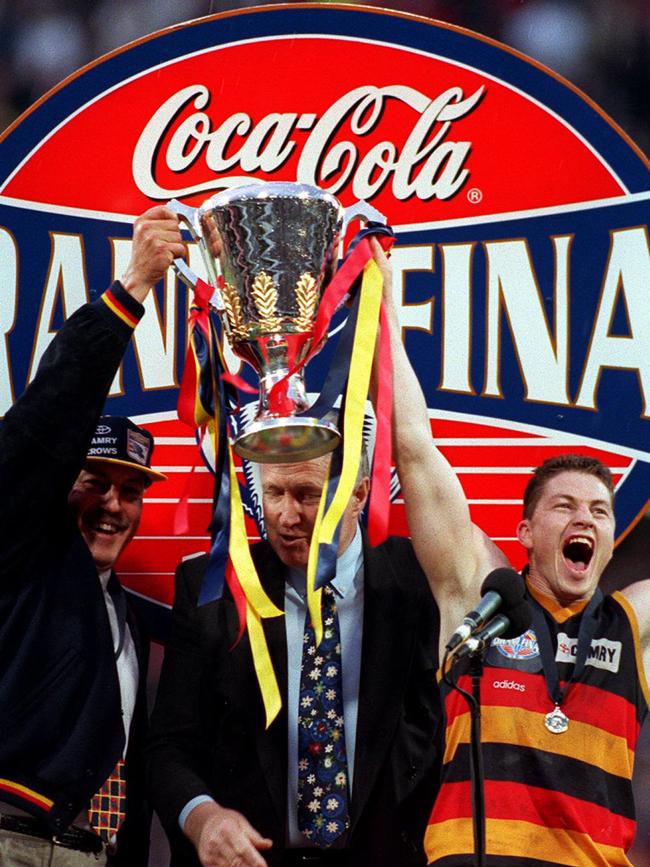 Malcolm Blight with Crows captain Mark Bickley hold 1997 premiership cup aloft.