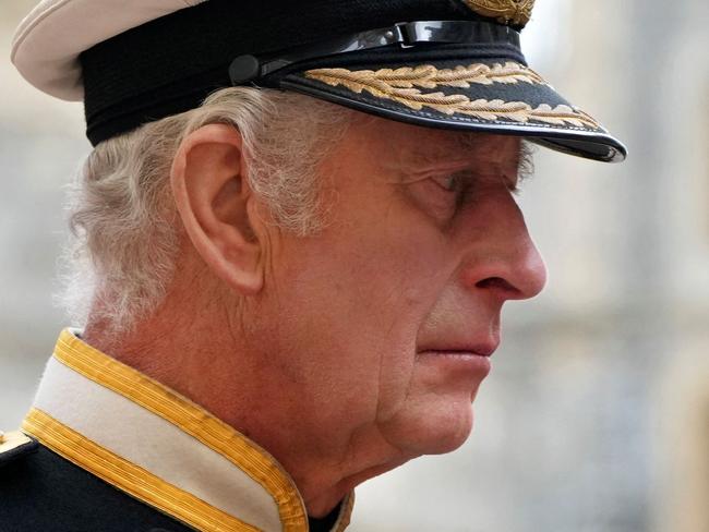 King Charles III follows the coffin as it arrives at the Committal Service for Britain's Queen Elizabeth II in St George's Chapel inside Windsor Castle on September 19, 2022. (Photo by Jon Super / POOL / AFP)