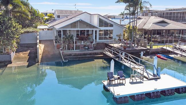 The four-bedroom, three-bathroom home at 32 Adaluma St, Buddina, will go to auction with the property marketed towards 'entry level' waterfront buyers.