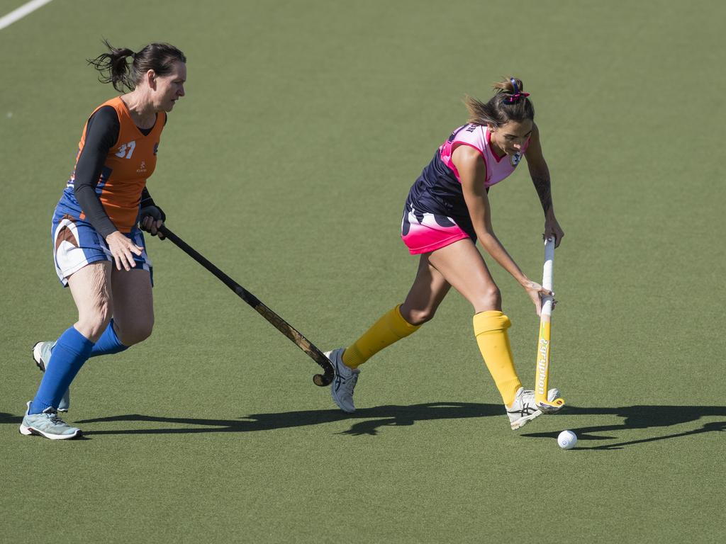 Megan Jackson (right) of Toowoomba 2 under pressure from Jenny Trotman of Maryborough 1.