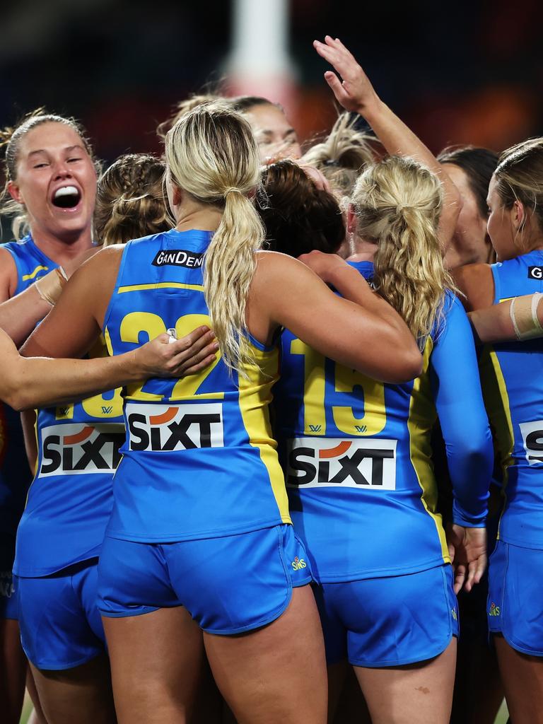 Stanton is mobbed by teammates after sealing a share of the spoils. Picture: Matt King/AFL Photos/via Getty Images