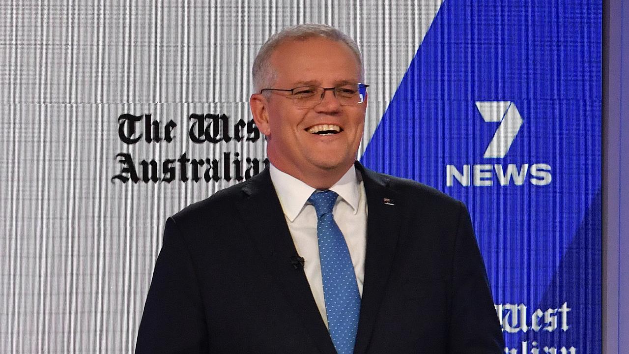 Scott Morrison enjoys a laugh during the debate. (AAP Image/Mick Tsikas)