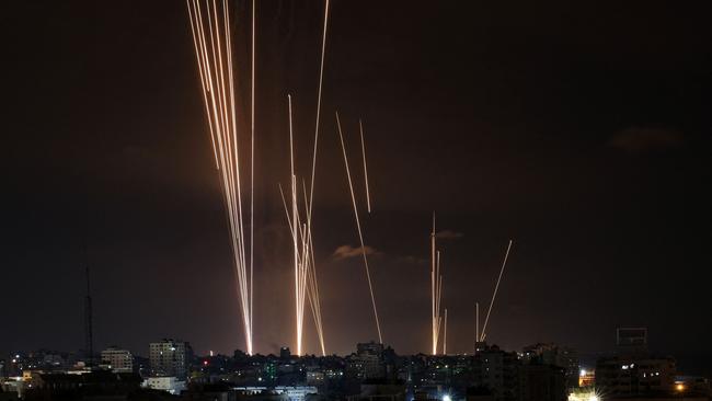 A salvo of rockets is fired by Palestinian militants from Gaza City toward Israel. Picture: AFP