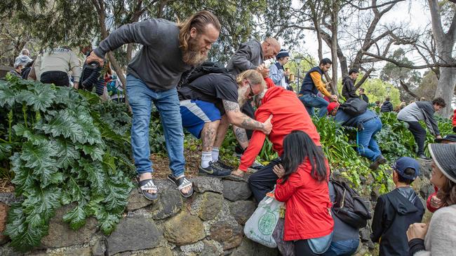 Fans try to max a quick move. Picture: Jason Edwards