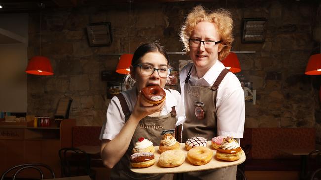 Porsha Gillott, Banjo’s senior staff member, and Colin Stack, shift supervisor, with the donuts. Banjo's Bakery Cafe has brought a sweet new addition in a range of gourmet donuts across all stores. Picture: Nikki Davis-Jones