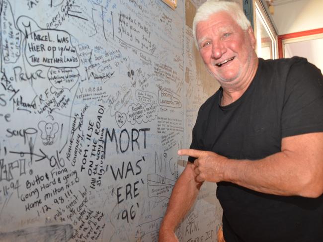 Grey nomad Richard Simpson stopped at Torrens Creek to see if his mate's name was still on the wall. "Mort is a special man. He's rotund, happy, drinks like a fish and loves his family," Mr Simpson said.