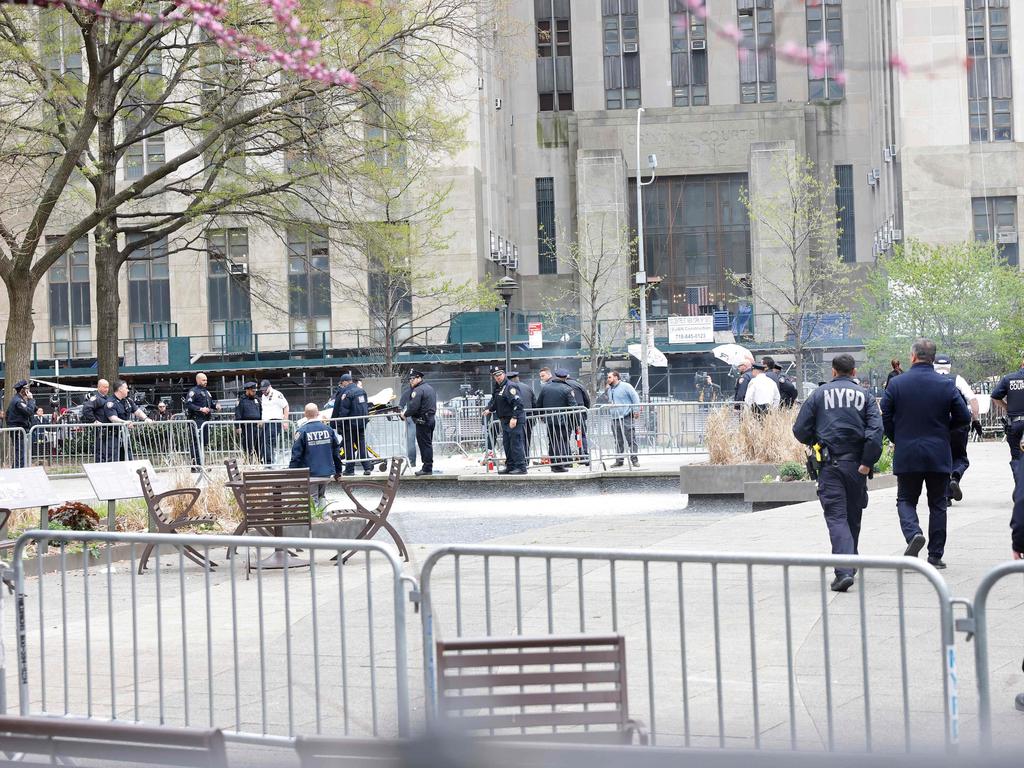 Police and civilians rush to help a man who had set himself on fire. Picture: Getty Images via AFP