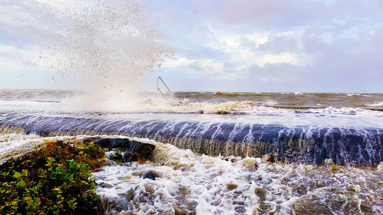 The rising sea at high tide flooding over the barriers. PHOTO CREDIT: Dianna Jean Photography.