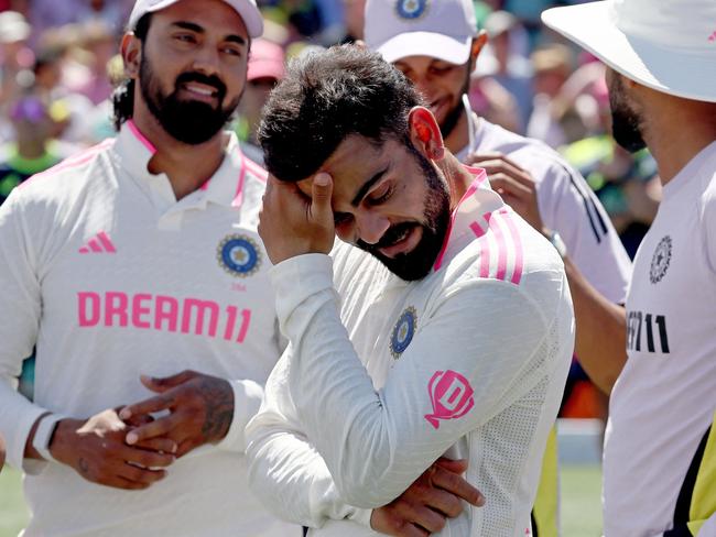 Indiaâs Virat Kohli (C) reacts with teammates during the trophy ceremony after the fifth cricket Test match between Australia and India at The SCG in Sydney on January 5, 2025. (Photo by DAVID GRAY / AFP) / -- IMAGE RESTRICTED TO EDITORIAL USE - STRICTLY NO COMMERCIAL USE --