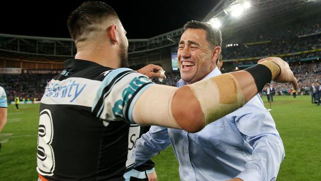 Shane Flanagan embraces Bird after the Sharks GF triumph. Photo: Colleen Petch.