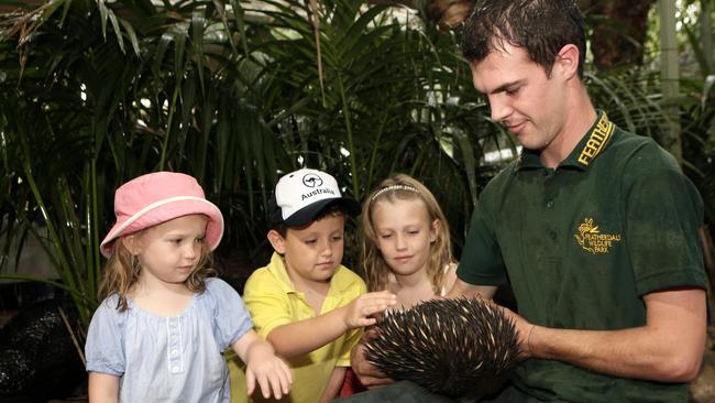 Keeper Jake Webb lets Sophie Strauss, 4, Felix Strauss, 7, and Elize Strauss, 7, get up close and personal with an echidna on May 27, 2013. Picture: John Fotiadis