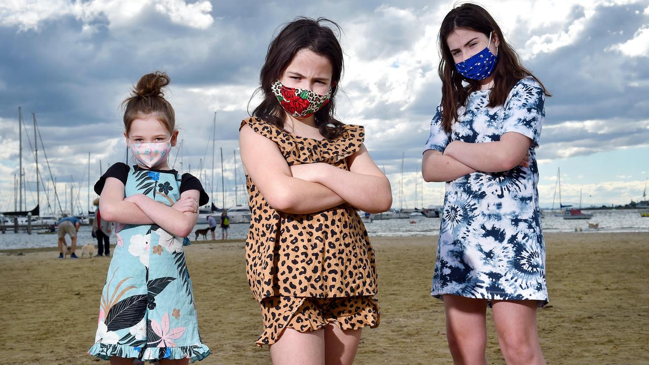 Victorian kids can finally ditch masks in class – unless they’re a household contact of a positive Covid case, in which case they need to wear a mask indoors. Pictured last August are Victorian students Zara and Frankie, both aged 7 at the time, and Sophie, then 11. Picture: Nicki Connolly