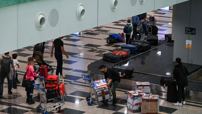 Passengers arriving at Changi Airport on October 20, a day after the country began quarantine-free entry for fully vaccinated passengers from eight countries. Picture: AFP