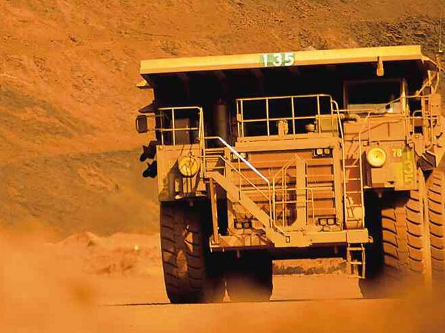 In this photograph supplied by BHP Billiton, a truck works at the BHP Billiton iron ore mine at Mount Whaleback at Newman in the Pilbara in Western Australia in this undated photo. Mining giant BHP Billiton vowed to keep pressing its US$150 billion (euro101 billion) bid to merge with Rio Tinto, telling shareholders it was a compelling step despite the rival company's resistance and customers' concerns 28 Nov 2007.