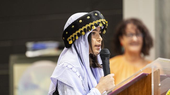 Yezidi community member Year 6 student Dleman Barakat shares her experiences at the Darling Heights State School Harmony Day celebration in 2024. Picture: Kevin Farmer