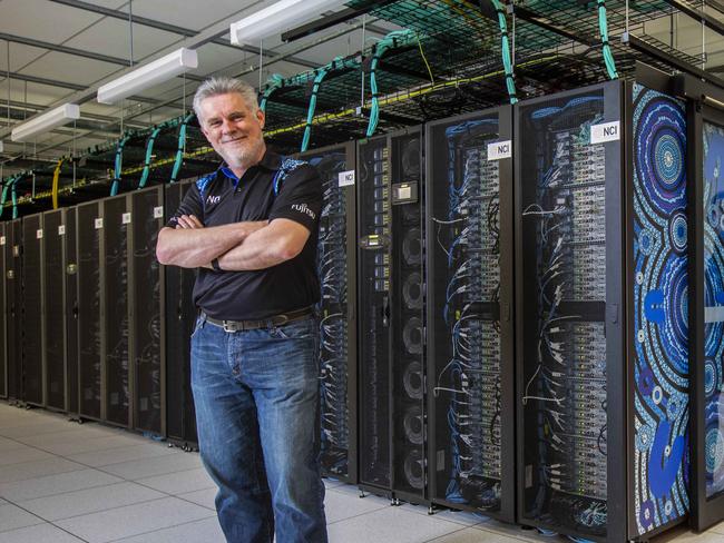 Australian National University Associate Professor Megan O'Mara (front) and Professor Sean Smith, Director of the National Computational Infrastructure, with ANU supercomputer 'Gadi'. Megan uses Gadi for research on COVID-19. Gadi is currently one of the fastest supercomputers in the world. Picture by Sean Davey.