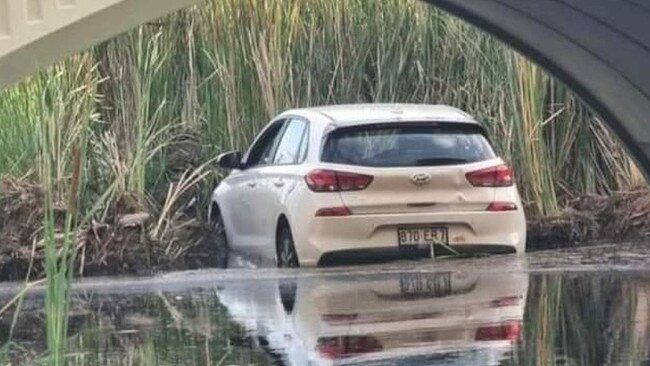 A stolen white Hyundai i30 was dumped in Bohle River on Friday. Pictures: Supplied.