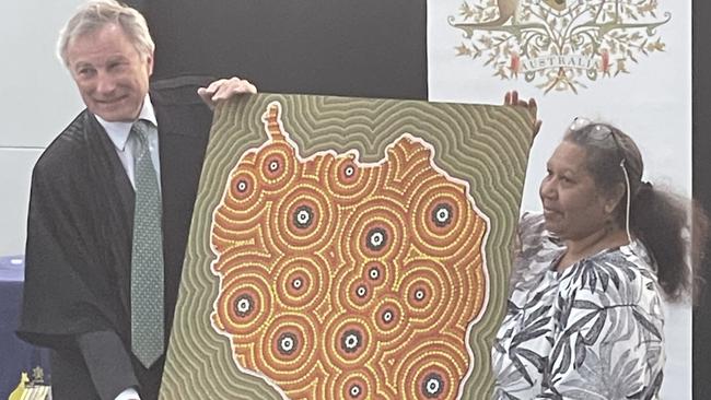 Justice Steven Rares was presented with a traditional artwork by Aunty Lois Johnson painted by Gilbert Laurie. Justice Rares told the assembly the artwork would be displayed in a prominent spot at the Federal Court.