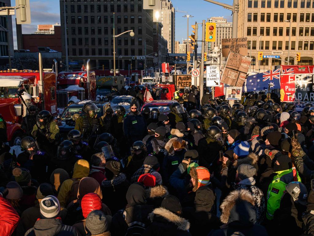 Demonstrators face off with police during a trucker-led protest over pandemic health rules and the Trudeau government, outside the parliament of Canada in Ottawa. Picture: AFP