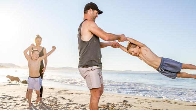 Brett and Jocelyn Williams with kids Mack, 6, and Jax, 8, at Main Beach in Byron Bay. Picture: Luke Marsden.