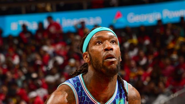 ATLANTA, GA - APRIL 13: Montrezl Harrell #8 of the Charlotte Hornets prepares to shoot a free throw during the game against the Atlanta Hawks during the 2022 Play-In Tournament on April 13, 2022 at State Farm Arena in Atlanta, Georgia. NOTE TO USER: User expressly acknowledges and agrees that, by downloading and/or using this Photograph, user is consenting to the terms and conditions of the Getty Images License Agreement. Mandatory Copyright Notice: Copyright 2022 NBAE (Photo by Scott Cunningham/NBAE via Getty Images)