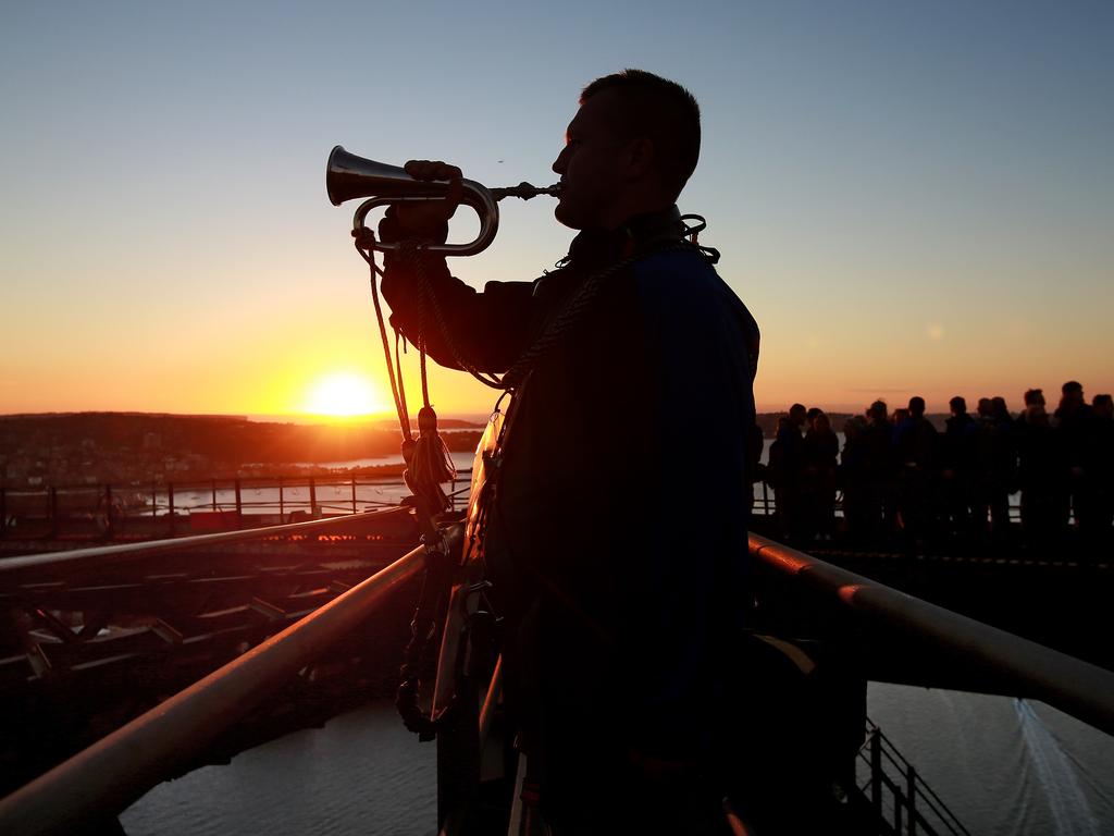 ***EXCLUSIVE TO DAILY TELEGRAPH. NO NEWS.COM*** A dawn service was held on the summit of the Sydney Harbour Bridge to commemorate ANZAC Day. Bugler and Leading seaman Marcus Salone plays The Last Post on top of the bridge. Picture: Toby Zerna