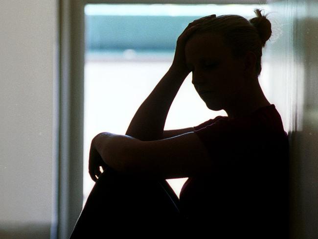 21 Dec 2001 Silhouette of young woman seated in doorway, date rape victim in Adelaide. Sexual Assault crime sa sex generic