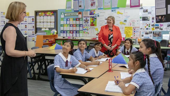 Top performer: John Paul College principal Karen Spiller drops in to a year 5 class.