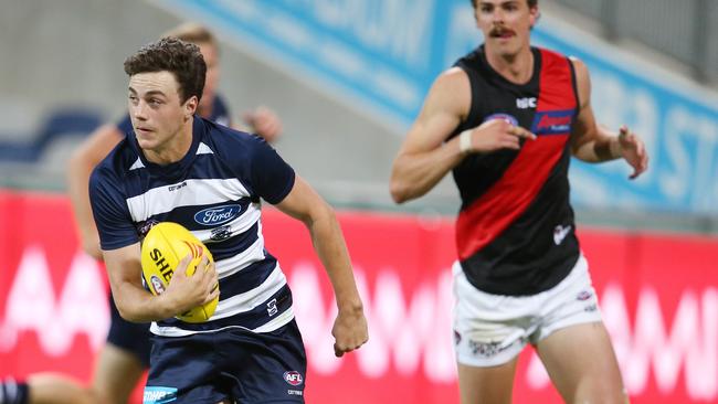 Jordan Clark dashes out of defence for Geelong against Essendon. Picture: Michael Klein