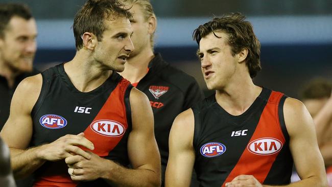 Jobe Watson and No. 1 draft pick Andrew McGrath after the game. Picture: Wayne Ludbey