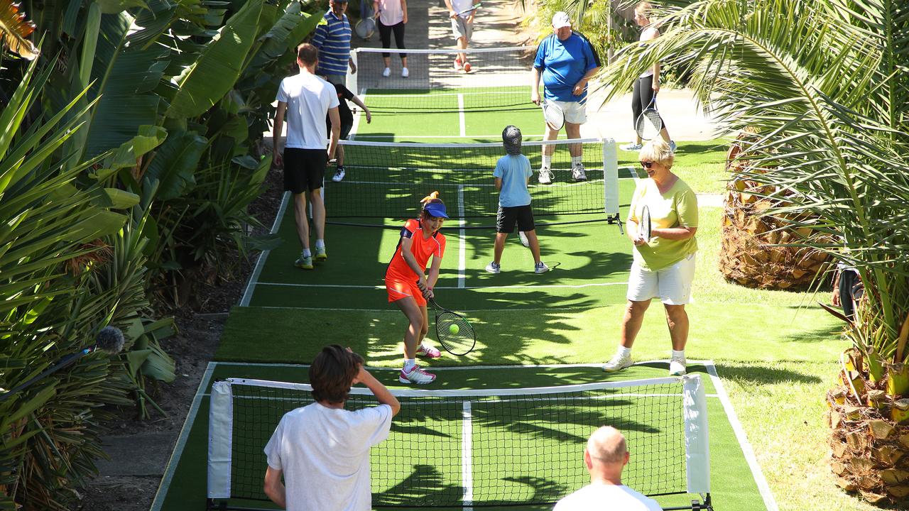 The Hampton street's backyard fences were removed in a bid to 'break down barriers' and encourage neighbourly relations. Picture: Graham Denholm