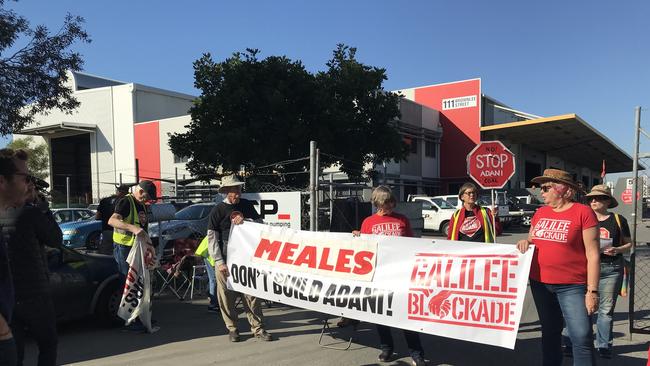 Anti-Adani protesters form a blockade at the Brisbane site owned by Specialised Concrete Pumping.