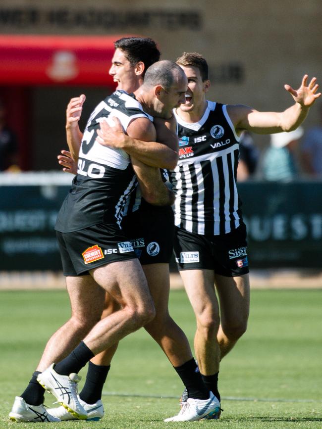 Matthew Broadbent hugs teammate Joel Garner after scoring a goal in the win at Alberton. Picture: AAP Image/ Morgan Sette