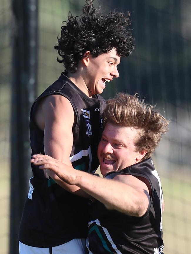 Omeo-Benambra pair Harry Warfe and Cody Graske celebrate a goal in the grand final win against Swifts Creek. Picture Yuri Kouzmin