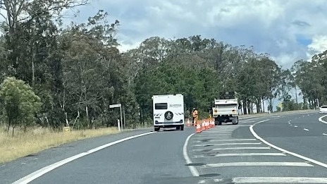 Emergency services battled to dampen a blaze which sparked after a truck rolled down an embankment on the New England Highway at Dalveen in the Southern Downs. Photo: Michael Hudson.