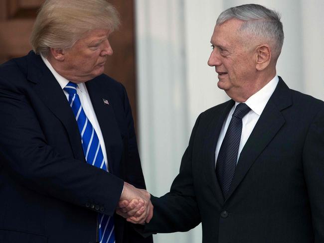 President Trump shakes hands with General James Matthis, who is now Secretary of Defense. Picture: AFP PHOTO / GETTY IMAGES NORTH AMERICA / Drew Angerer