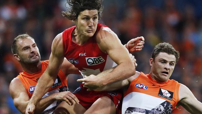 Kurt Tippett tries to mark over Joel Patfull and Heath Shaw. Picture: Phil Hillyard