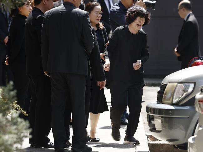 Jung Hee Hong, the devastated mother of Min Cho, as she farewelled the coffins. Picture: Richard Dobson