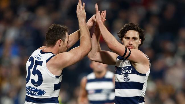 Patrick Dangerfield and Gryan Miers celebrate a goal against Hawthorn. Picture: Michael Willson/AFL Photos via Getty Images.