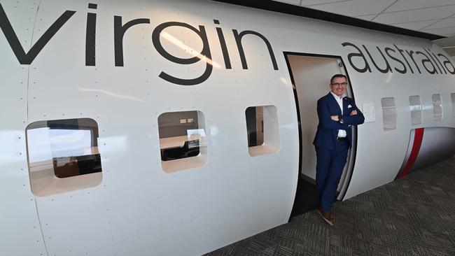 Paul Scurrah in front of his temporary new office, a former aircraft fuselage, at Virgin Australia’s new headquarters in South Brisbane. Picture: Lyndon Mechielsen