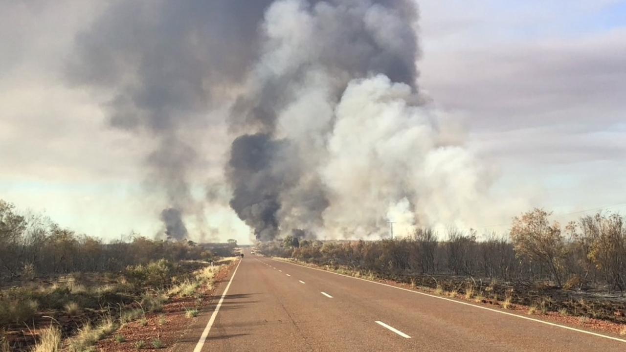 Smoke impacted the Stuart Hwy on Sunday from a fire north of Wycliffe Well. Picture: BushfiresNT.