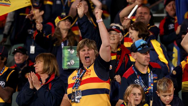 Fans will be able to touch the football if it lands in the Adelaide Oval stands on Saturday. Picture: James Elsby/AFL Photos via Getty Images